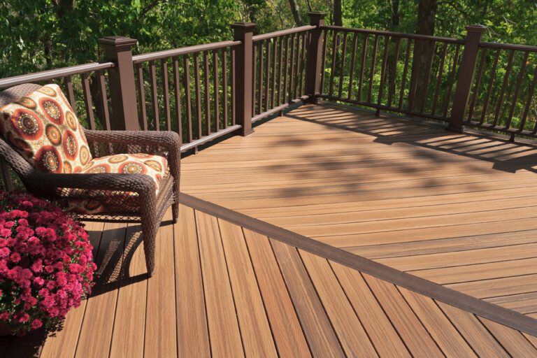 a deck with a chair and a railing