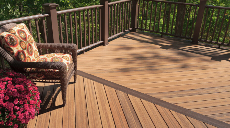 a deck with a chair and a railing