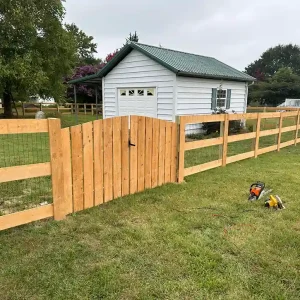 Three-Rail Split Rail Wood Fence with a Dog-Ear Picket Gate Raleigh
